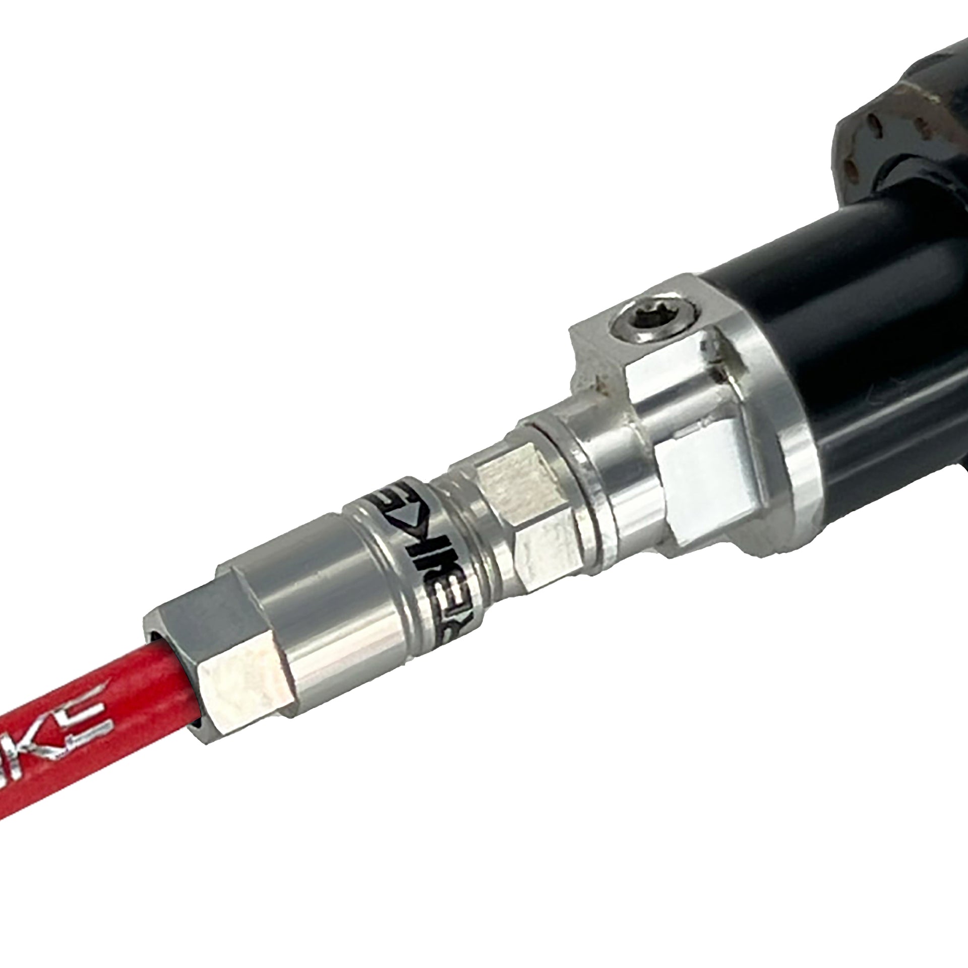 red reverb hose installed in a dropper post on a white background