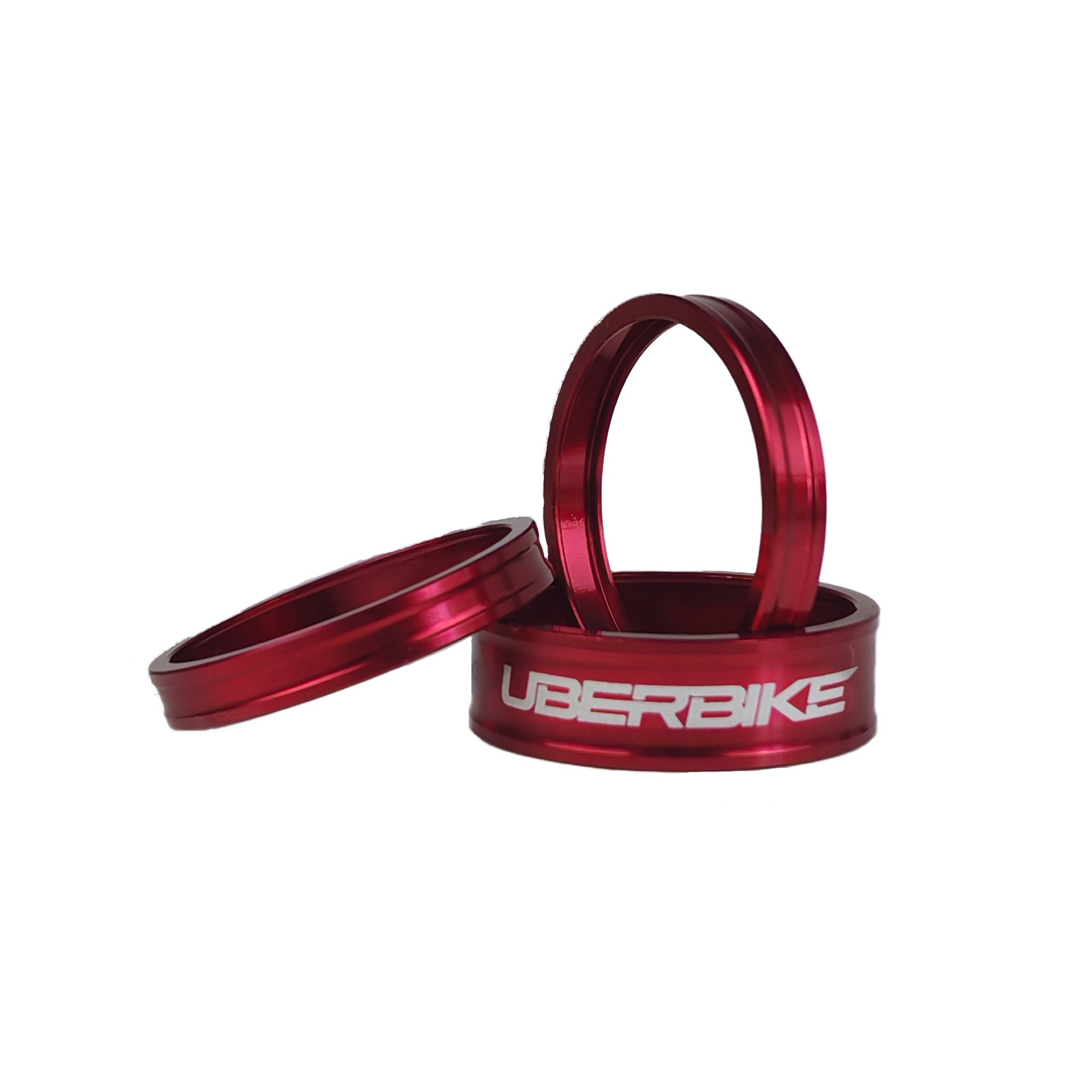 3 red headset spacers with Uberbike branding on a white background