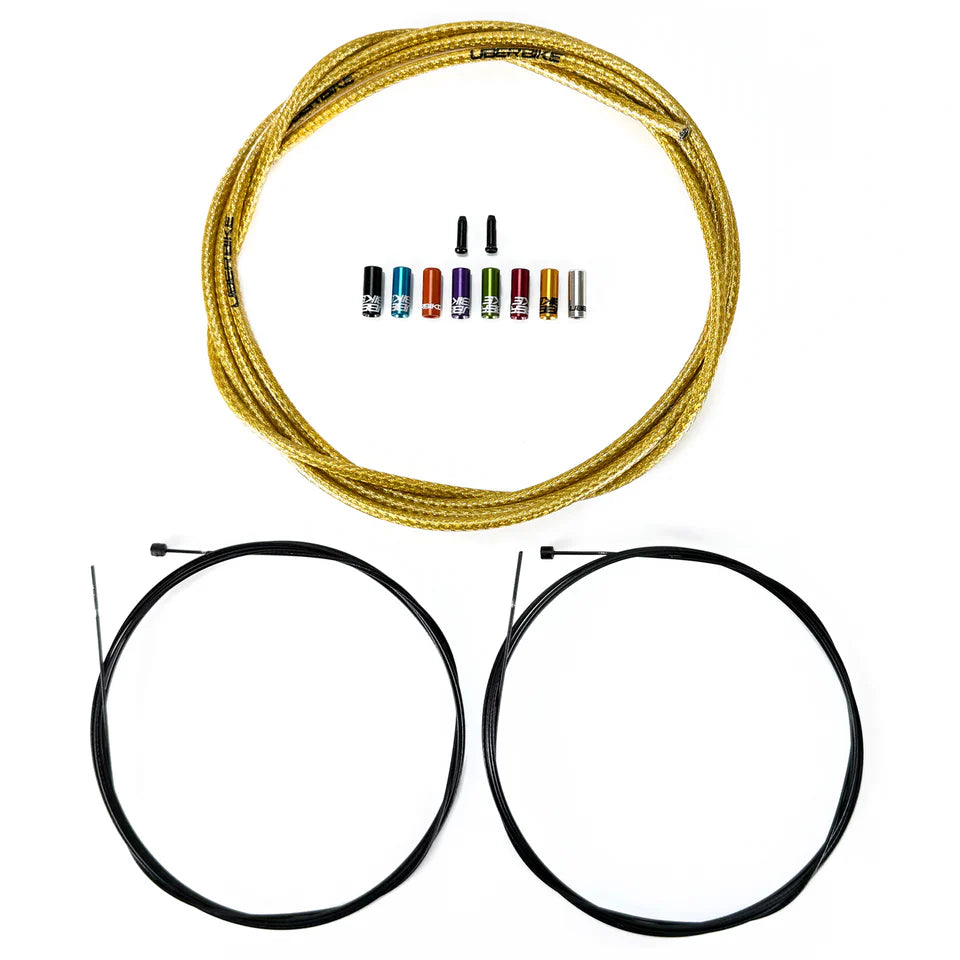 Set of bicycle gear cables and ferrules with gear inner wires on a white background