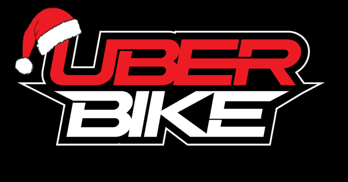 Uberbike logo with a Santa hat on a black background