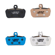 4 different compounds with Uberbike branding for sram avid trail finned insert pads on a white background
