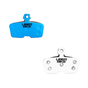 two uberbike branded brake pad inserts for sram motive ultimate brake systems, on a white background