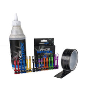 Collection of tubeless wheel products including a tyre sealant, valves, and tape on a white background