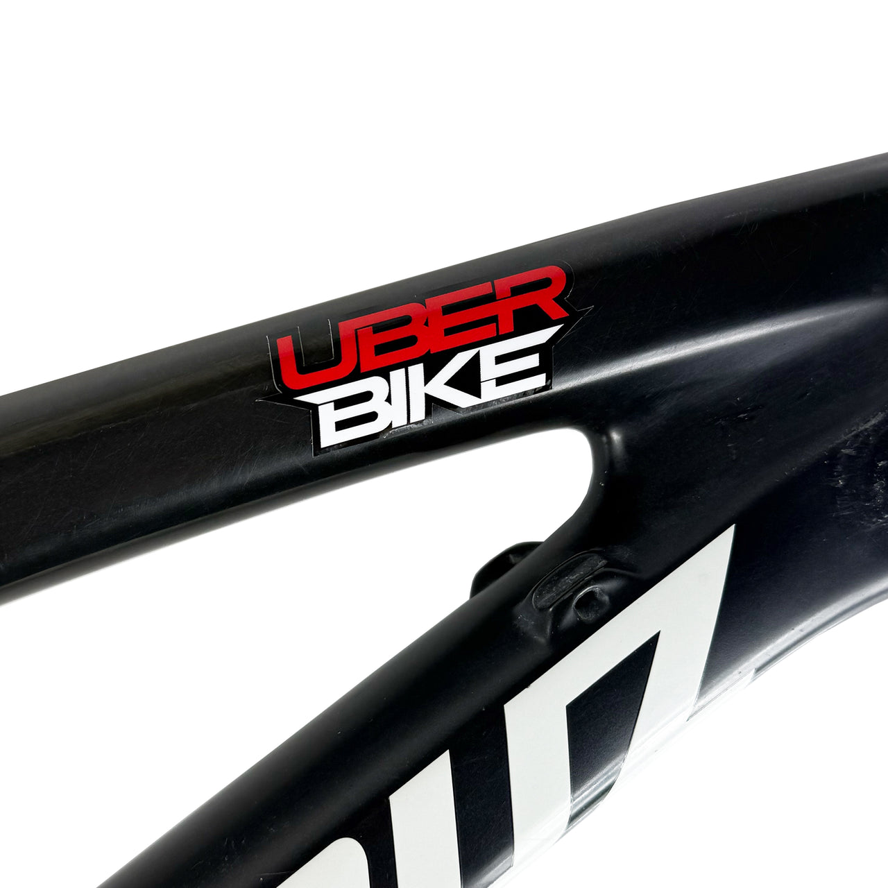 Uberbike stack logo sticker on a bike frame, on a white background