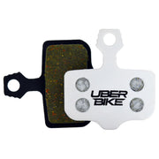 Bicycle brake pads with 'UberBike' branding on a white background.