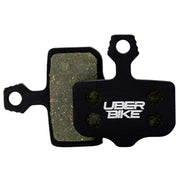 Brake pads with 'UberBike' branding on a white background.